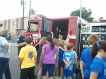 Kids touring fire truck second angle