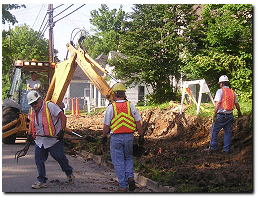 Murray Street Department employees performing repairs on a street